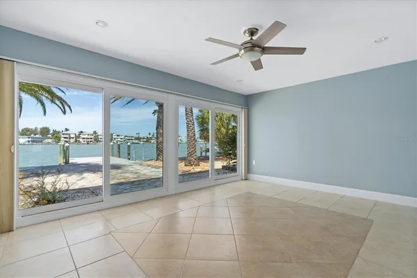 a large kitchen with stainless steel appliances kitchen island granite countertop a sink and cabinets