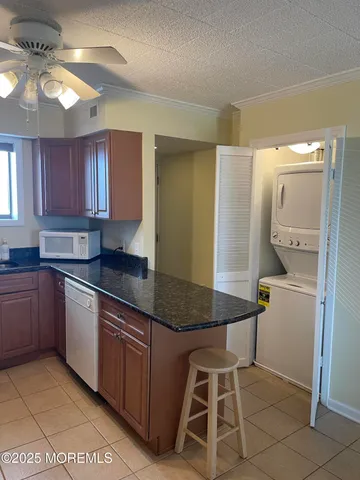 a kitchen with a sink cabinets and window