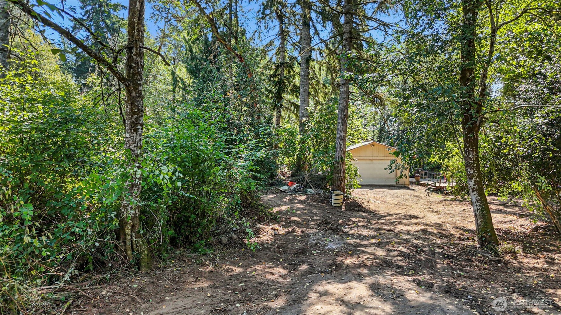 18220 70th St Court Southwest Longbranch, WA 98351 - Photo 11 of 21 a view of a outdoor space and a trees