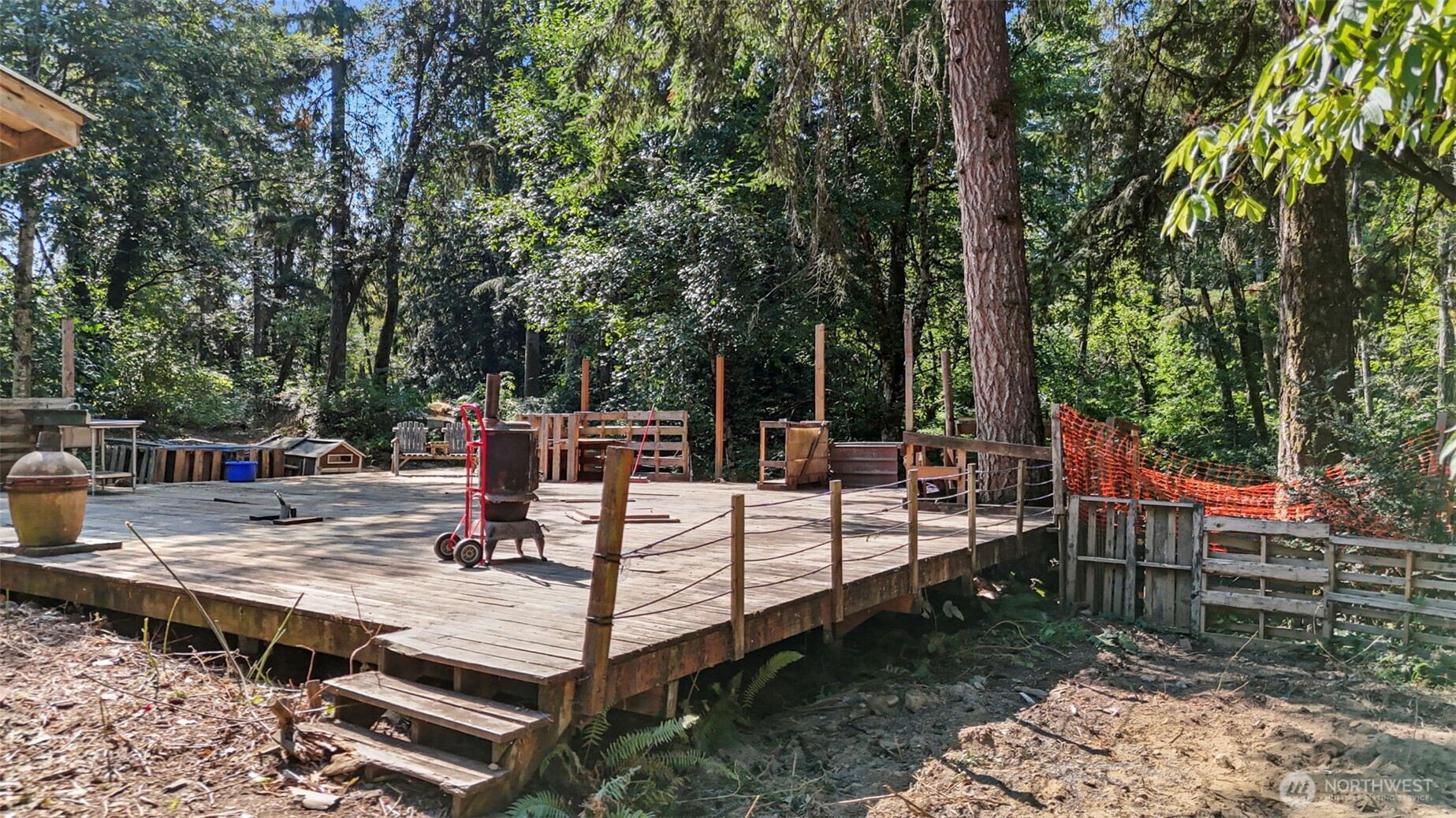 18220 70th St Court Southwest Longbranch, WA 98351 - Photo 14 of 21 a view of a backyard with sitting area
