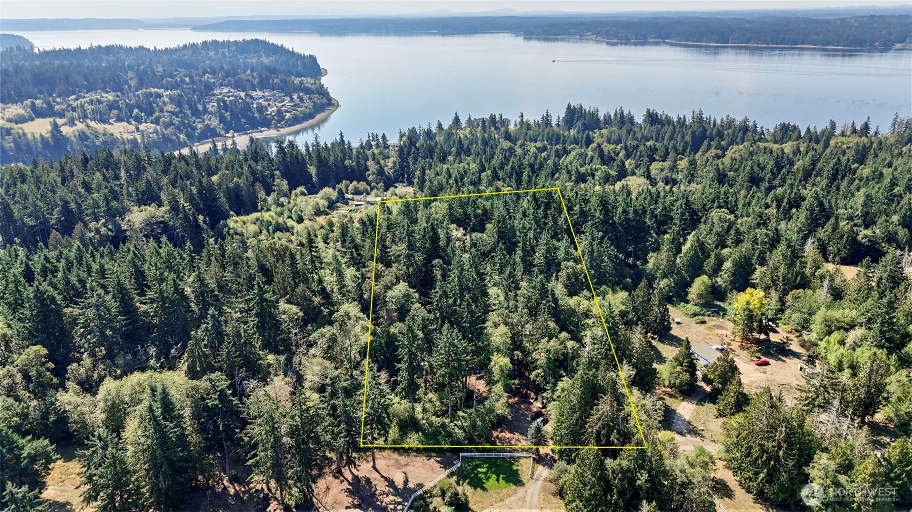 18220 70th St Court Southwest Longbranch, WA 98351 - Photo 21 of 21 a view of a lake with a mountain in the background