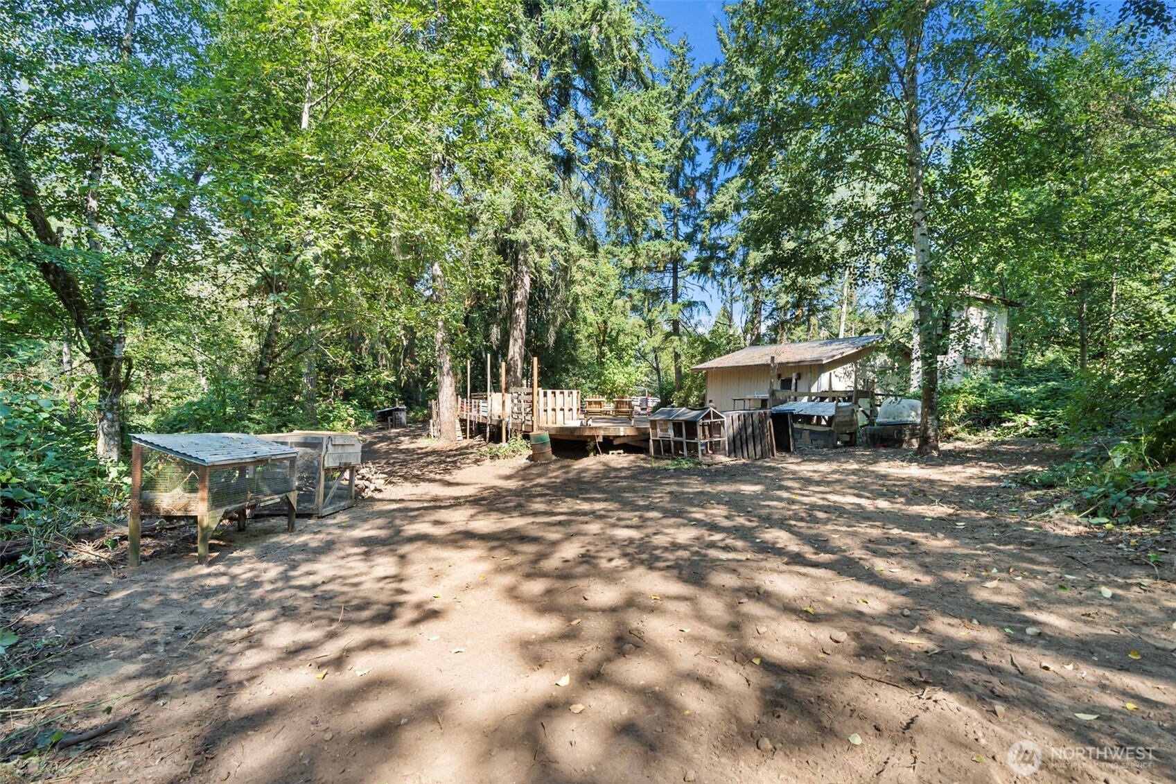 18220 70th St Court Southwest Longbranch, WA 98351 - Photo 7 of 21 a view of a house with backyard and sitting area