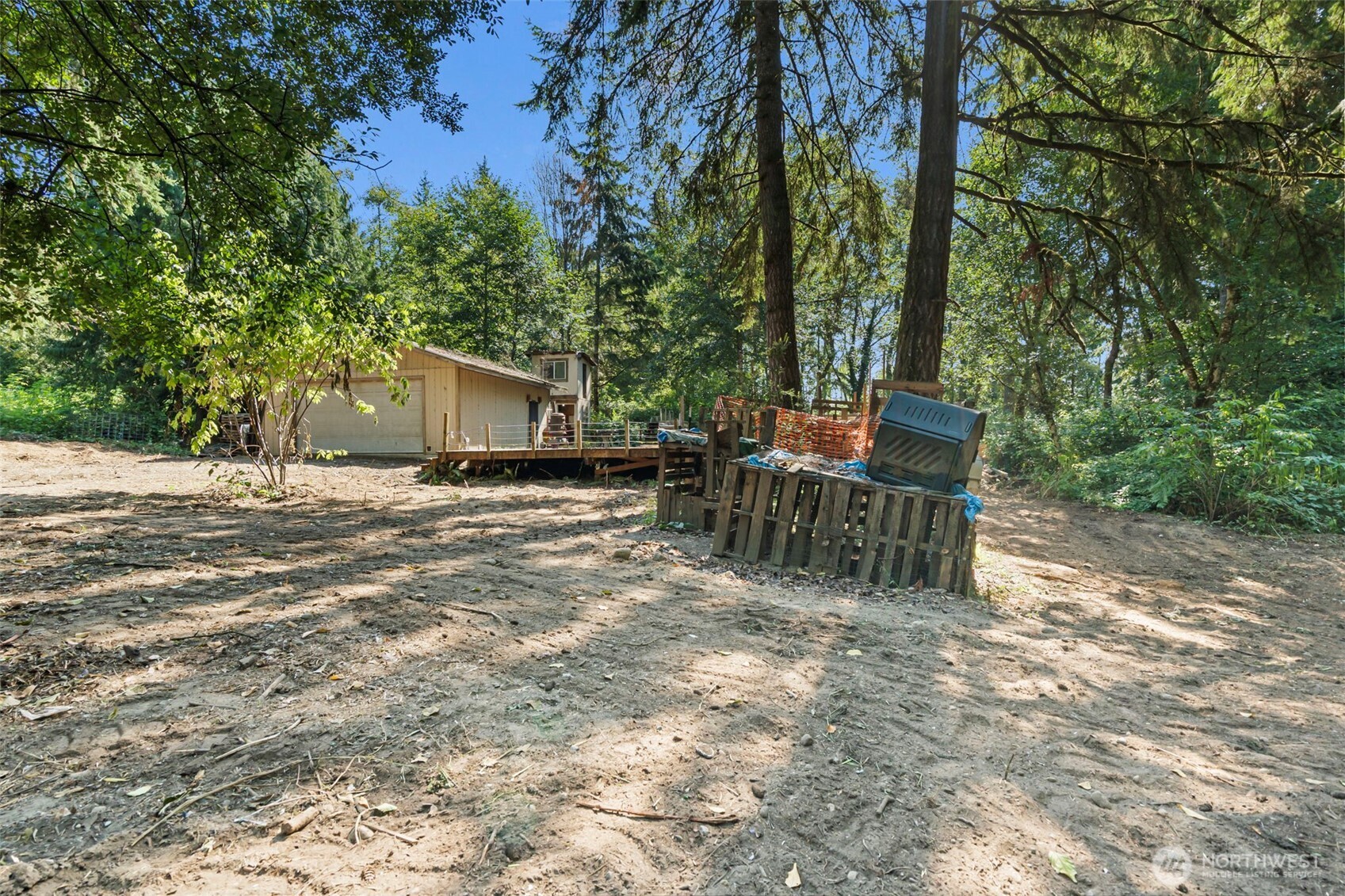 18220 70th St Court Southwest Longbranch, WA 98351 - Photo 9 of 21 a backyard of a house with table and chairs