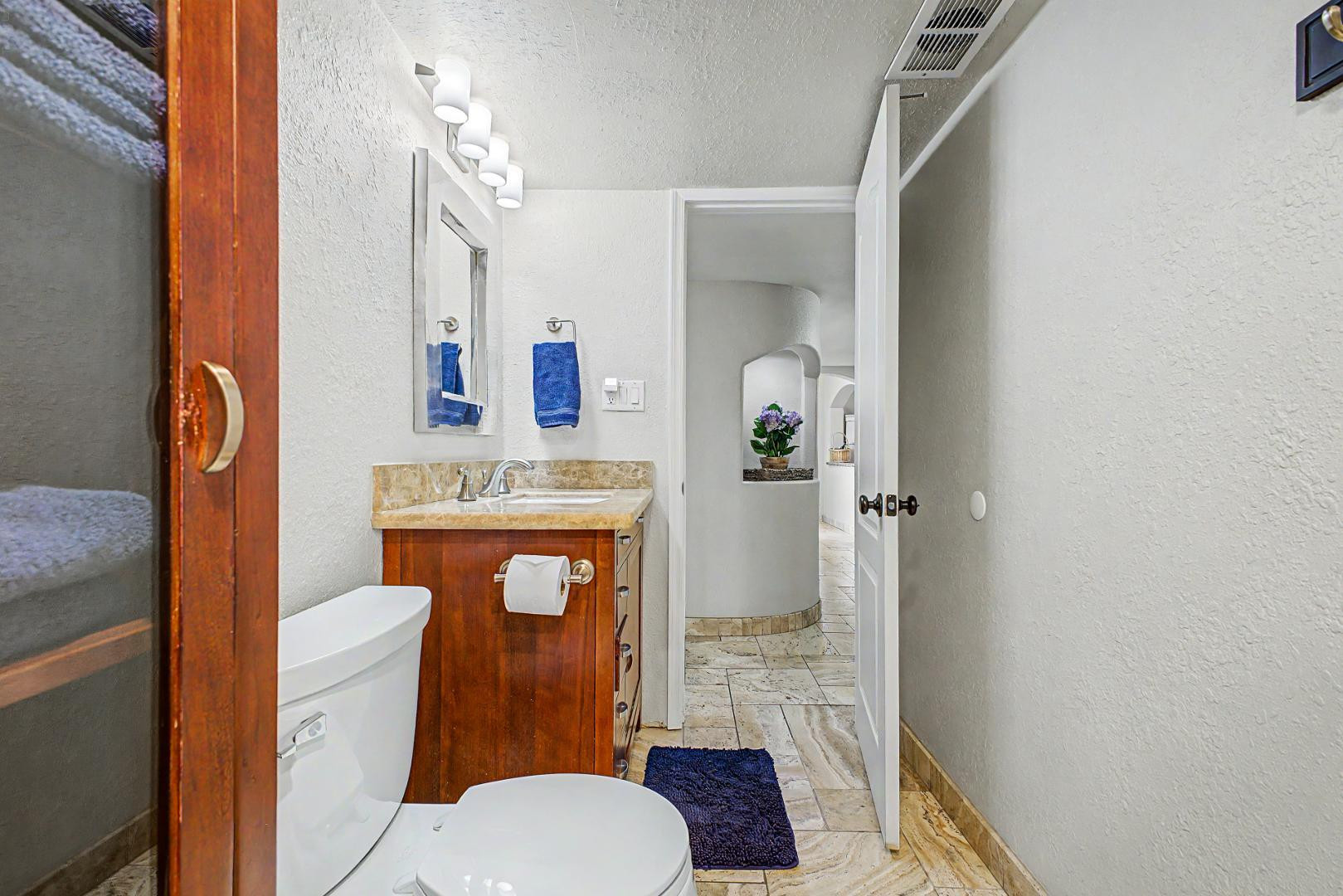 3346 East Cochise Road Phoenix, AZ 85028 - Photo 29 of 40 a bathroom with a toilet a sink and mirror
