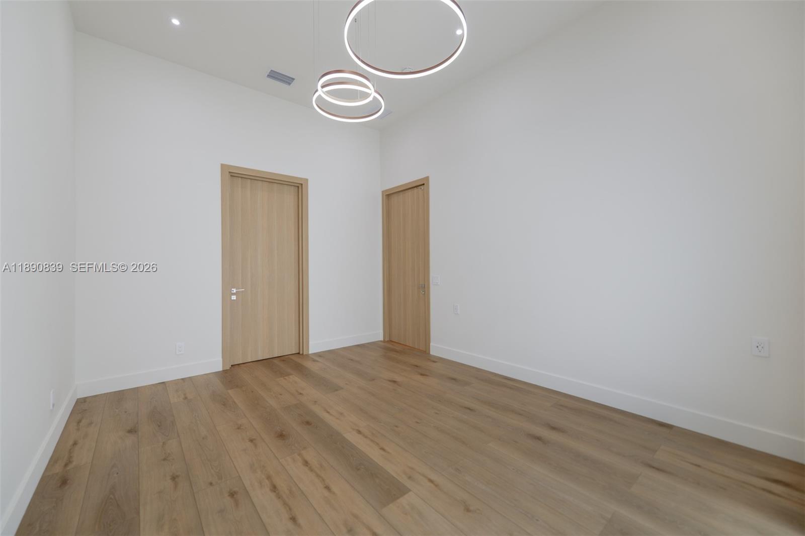 635 Southwest 9th Street Hallandale Beach, FL 33009 - Photo 14 of 38 a view of a room with wooden floor