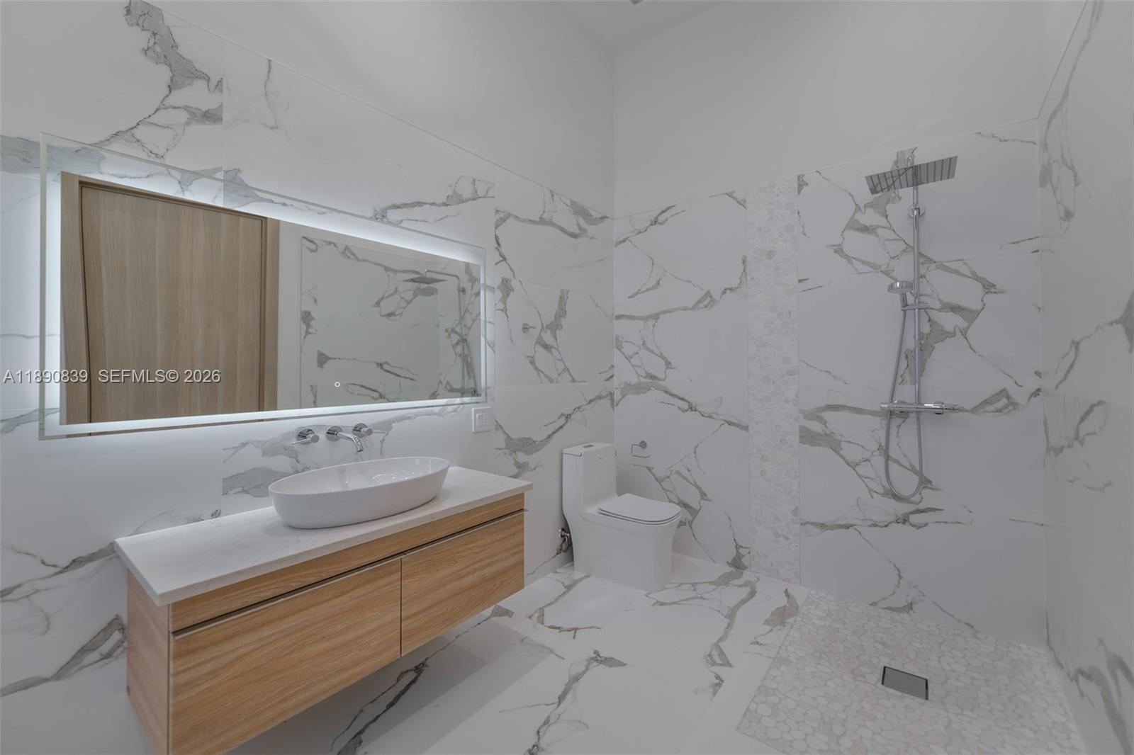 635 Southwest 9th Street Hallandale Beach, FL 33009 - Photo 16 of 38 a bathroom with a sink toilet and shower