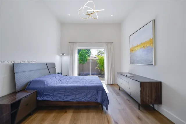 an empty room with wooden floor and closet