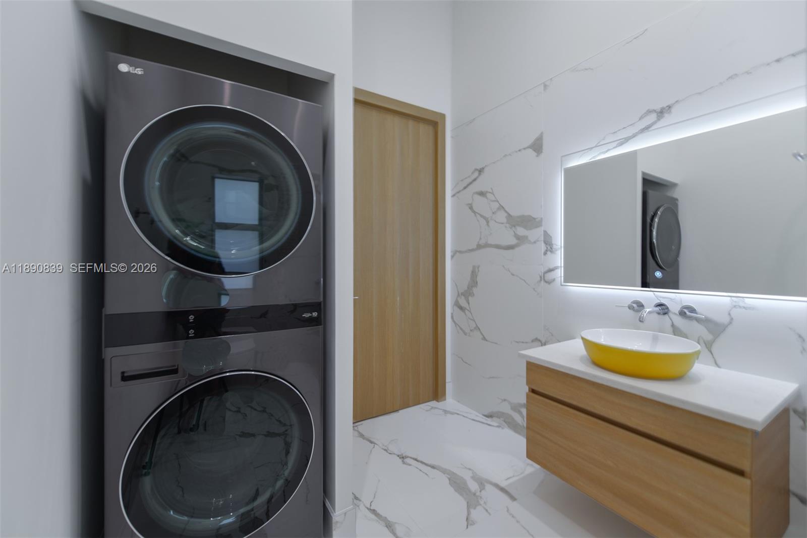 635 Southwest 9th Street Hallandale Beach, FL 33009 - Photo 23 of 38 a bathroom with a sink a mirror and toilet