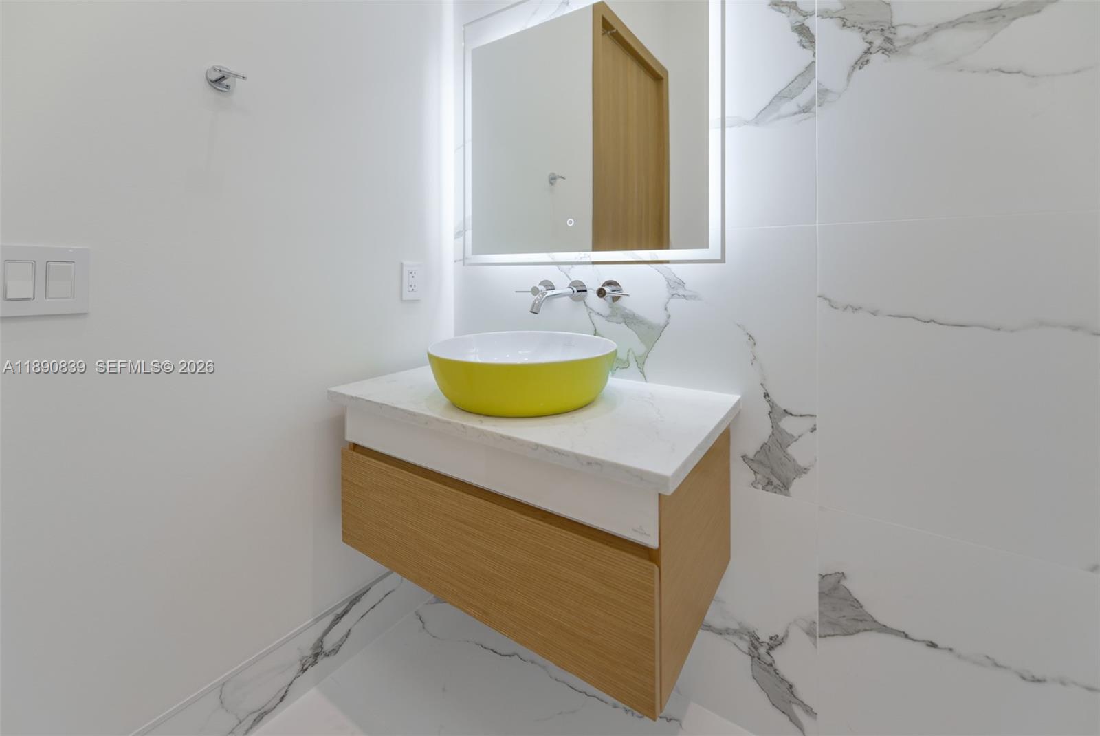 635 Southwest 9th Street Hallandale Beach, FL 33009 - Photo 25 of 38 a bathroom with a sink a toilet and a mirror