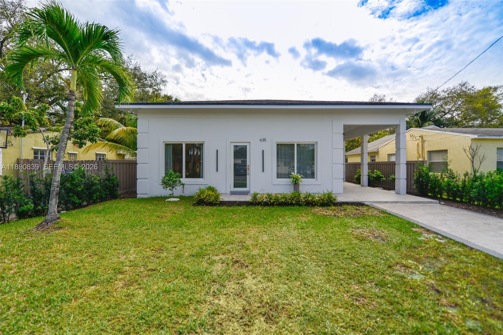 635 Southwest 9th Street Hallandale Beach, FL 33009 - Photo 34 of 38 a view of a house with backyard and garden