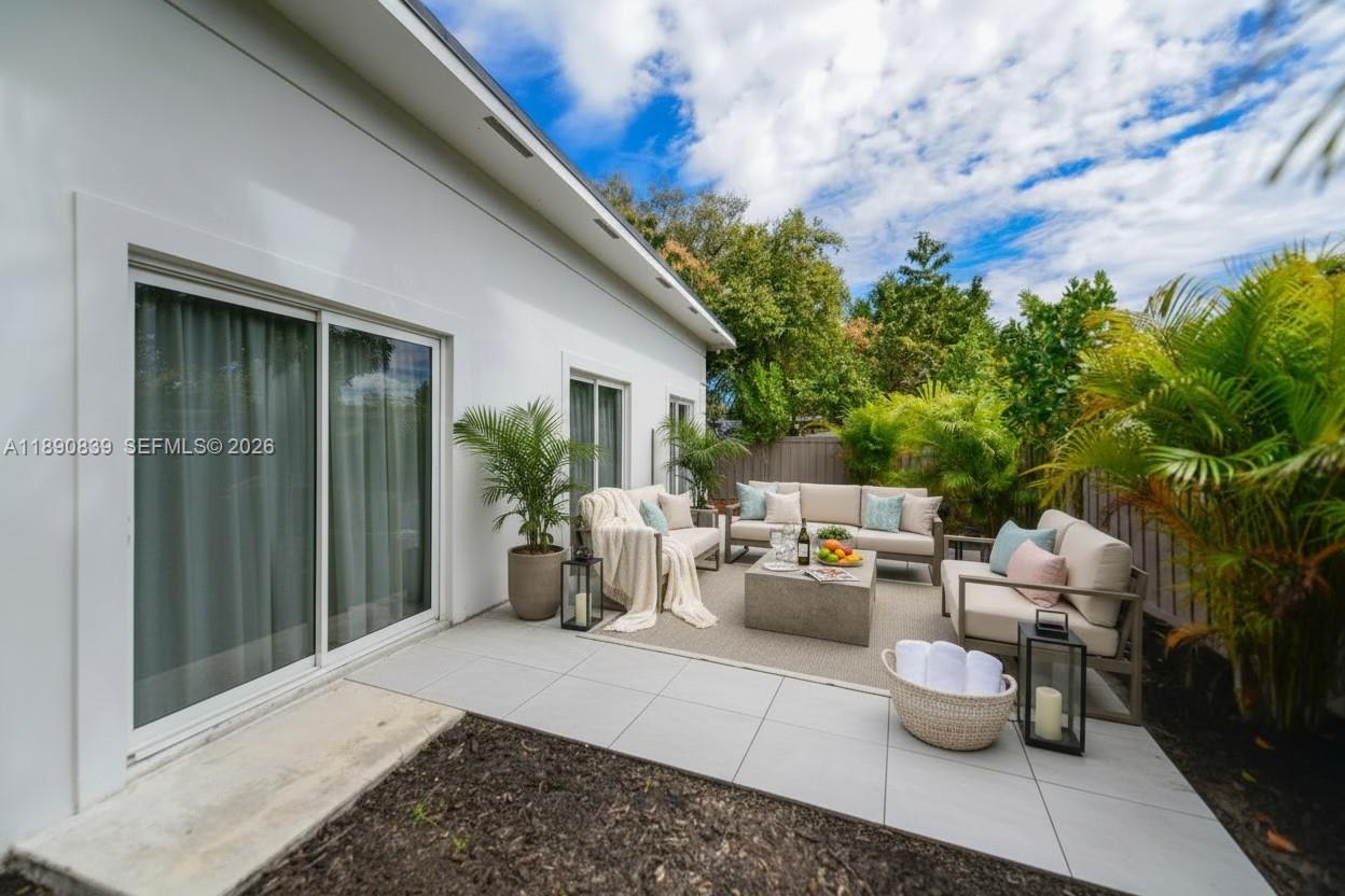 635 Southwest 9th Street Hallandale Beach, FL 33009 - Photo 38 of 38 a view of a patio with couches and potted plants