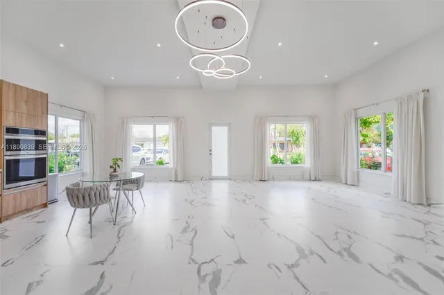 a view of a livingroom with furniture and windows
