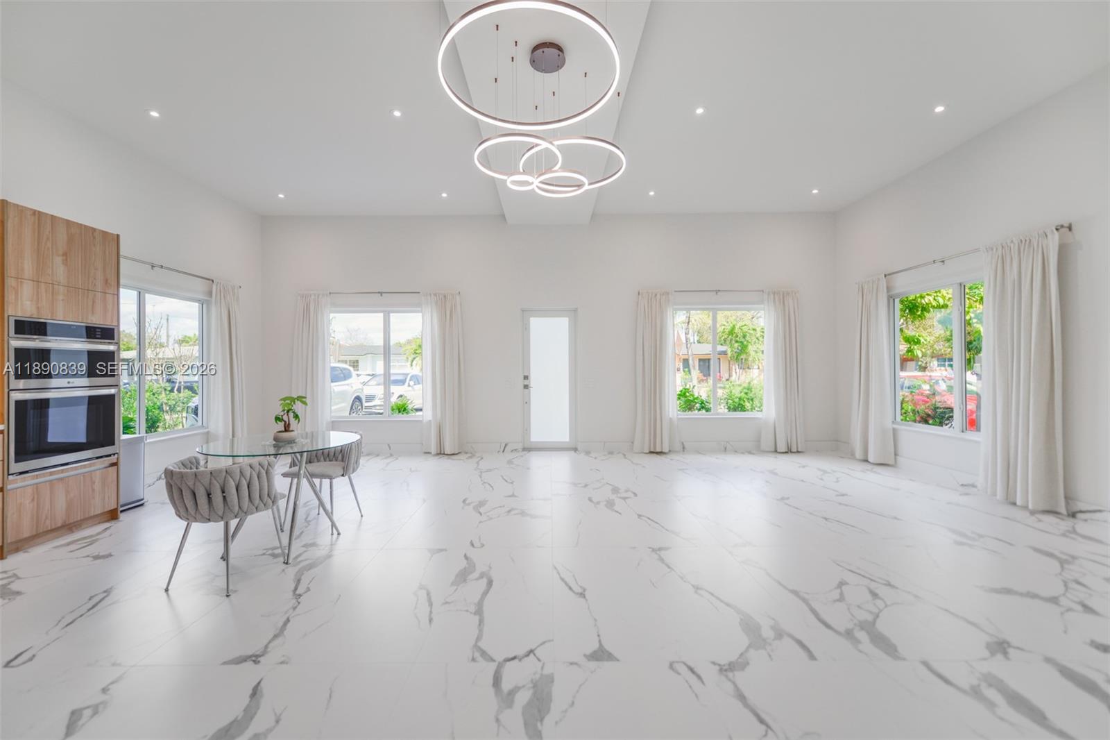 635 Southwest 9th Street Hallandale Beach, FL 33009 - Photo 4 of 38 a view of a livingroom with furniture and windows