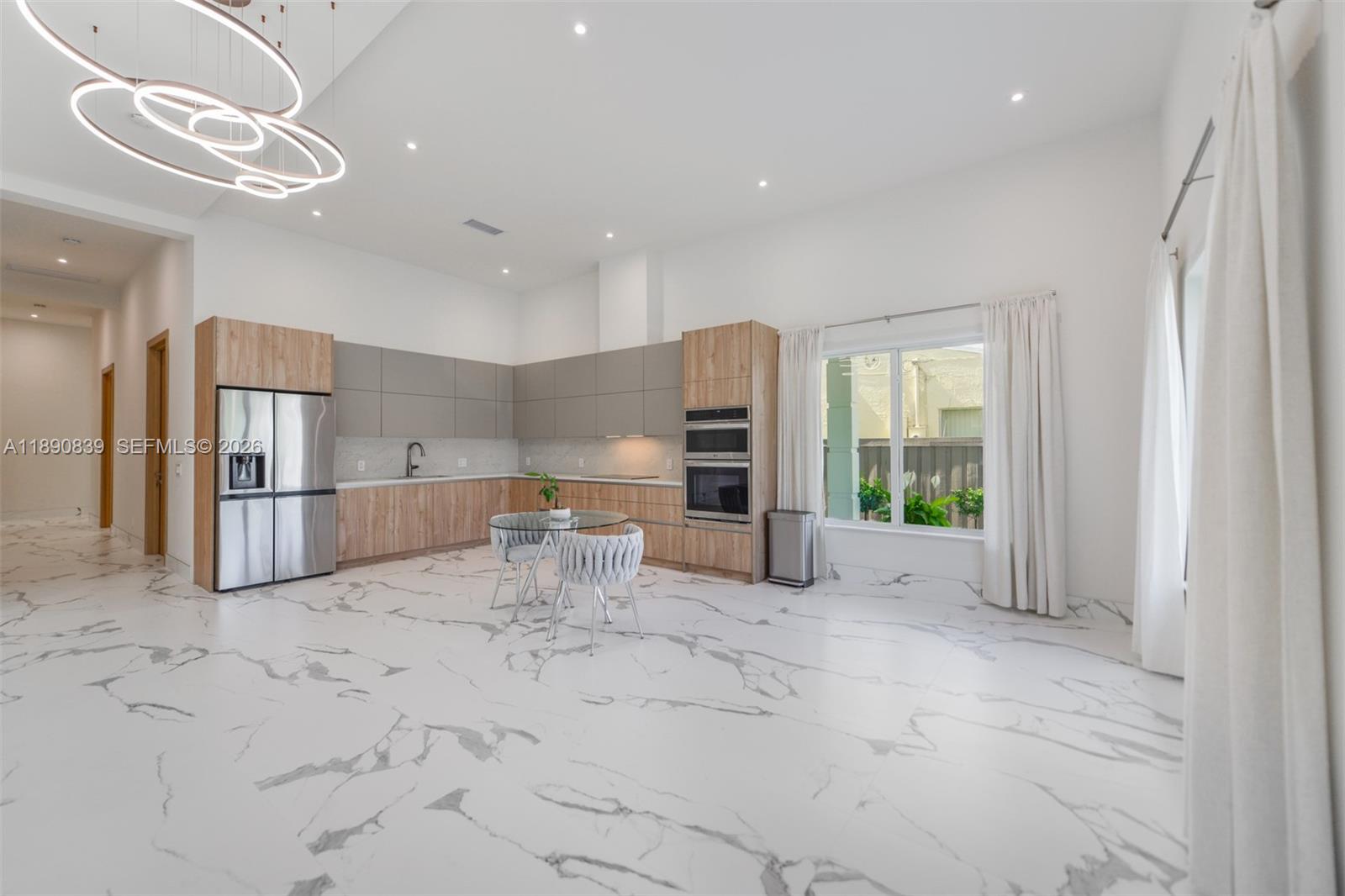 635 Southwest 9th Street Hallandale Beach, FL 33009 - Photo 5 of 38 a view of kitchen with stainless steel appliances refrigerator oven and cabinets