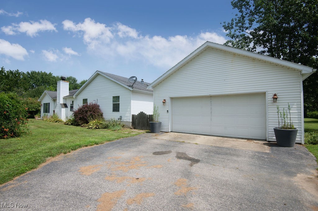 4594 Center Road Andover, OH 44003 - Photo 38 of 39 View of property exterior with an outbuilding and a yard