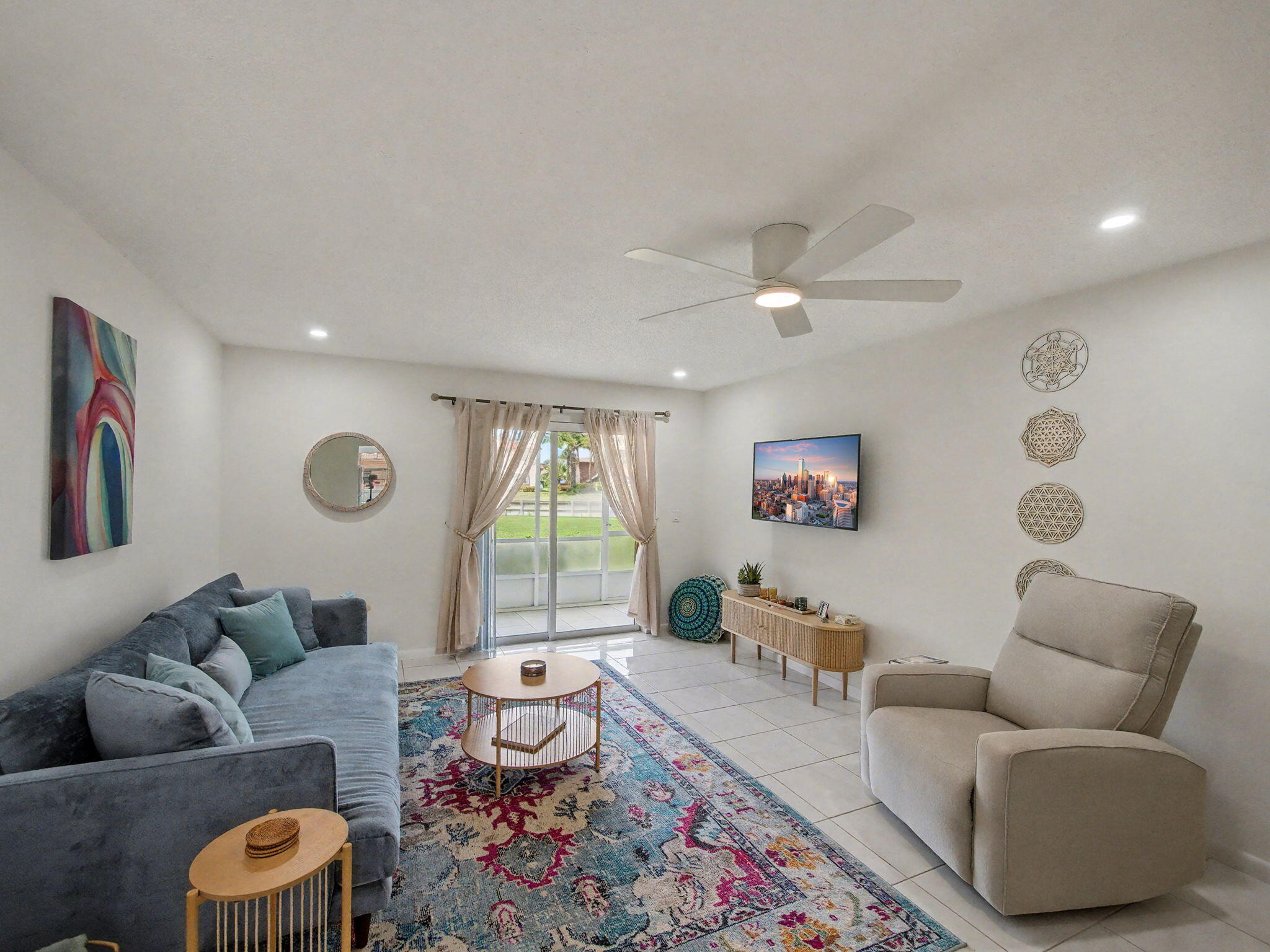 1967 Southwest Palm City Road, Unit 34C Stuart, FL 34994 - Photo 8 of 25 a living room with furniture and a large window