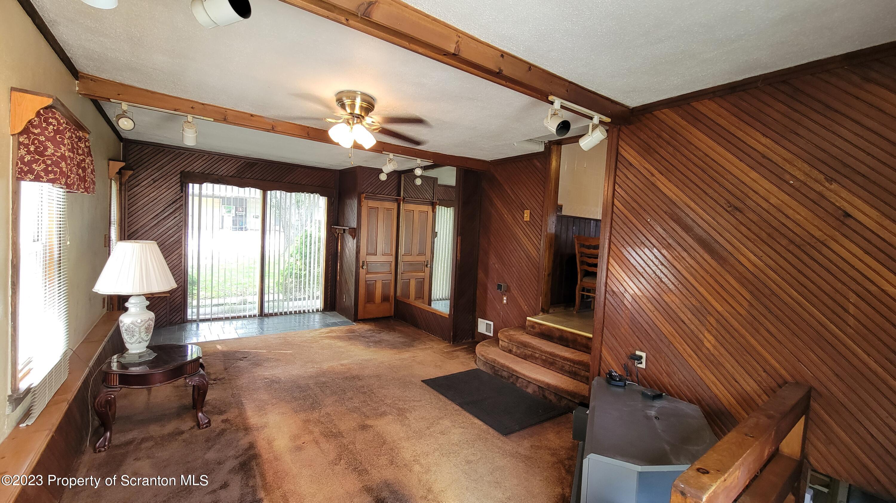 14 Main Street Hallstead, PA 18822 - Photo 3 of 16 a view of a livingroom with furniture and a ceiling fan