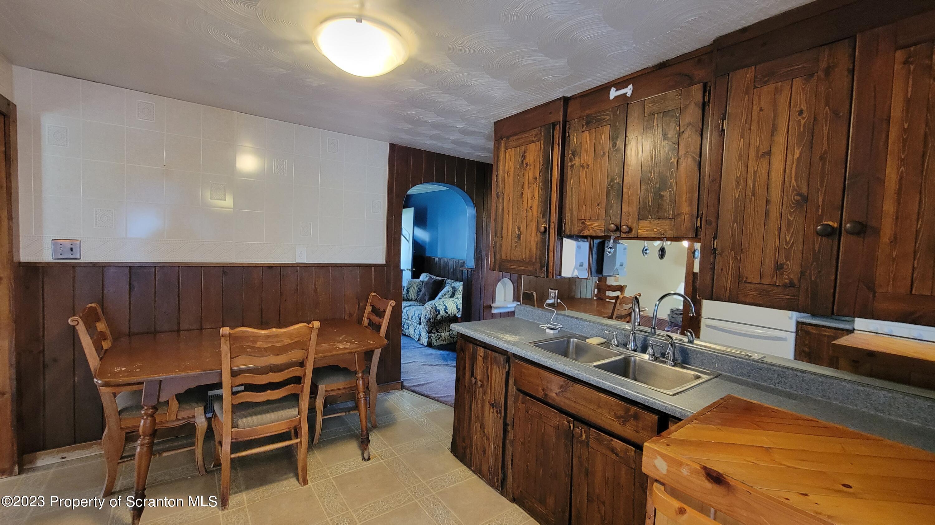 14 Main Street Hallstead, PA 18822 - Photo 8 of 16 a kitchen with a sink cabinets and wooden floor