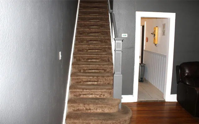 a view of an entryway with wooden floor