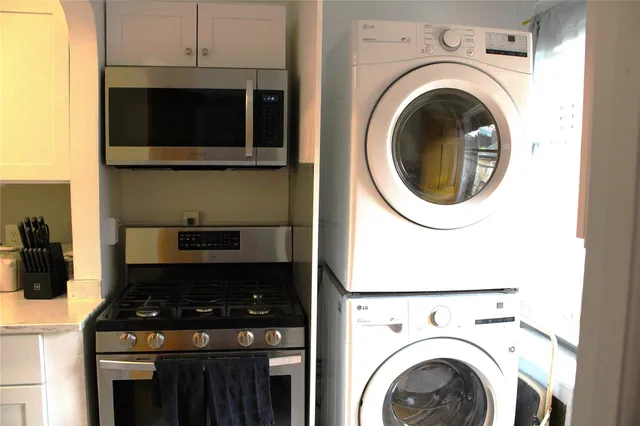 a kitchen with a stove and a microwave