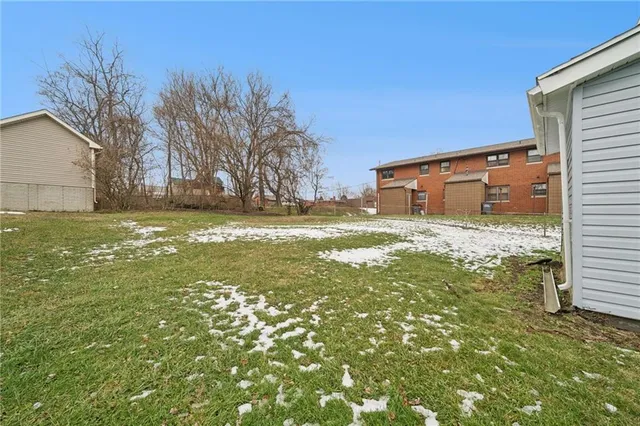 a view of a yard with an outdoor space