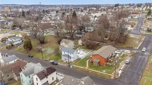 an aerial view of a house with a garden