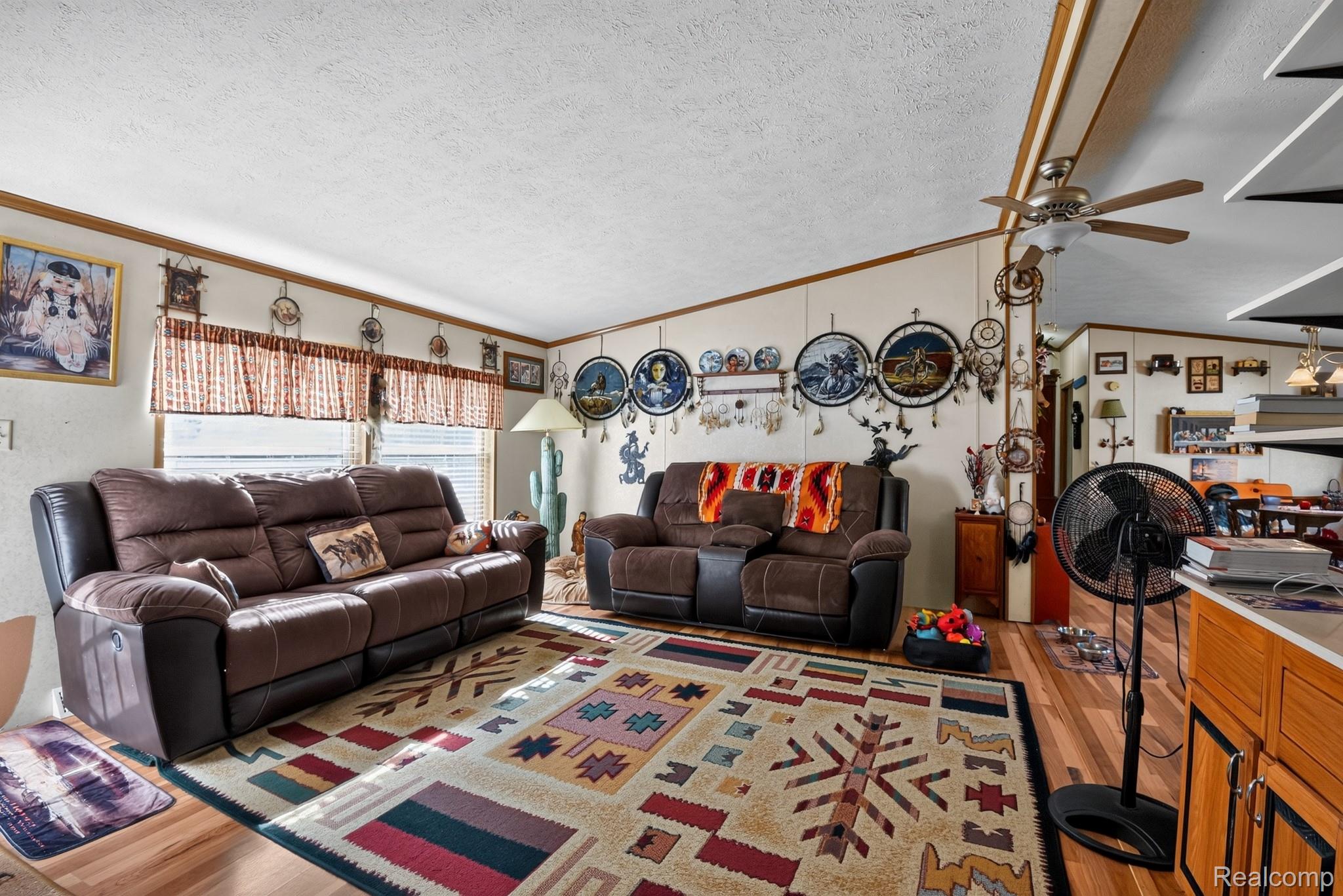 6266 Kikendall Road Eaton Rapids, MI 48827 - Photo 15 of 36 Recessed lighting, wood-finish flooring, ceiling fan, and window with blinds