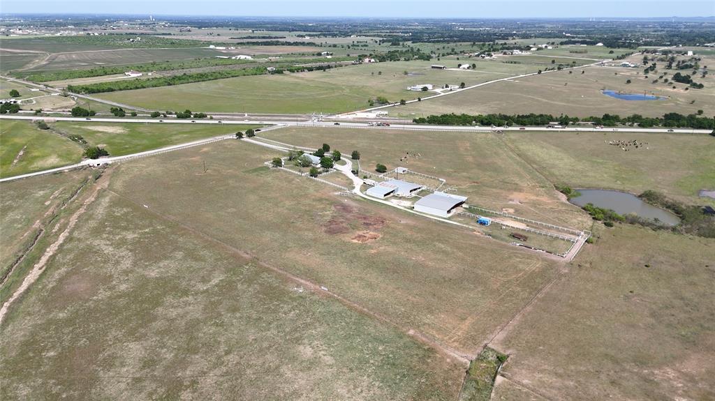 111 Lund Road Elgin, TX 78621 - Photo 14 of 15 an aerial view of residential building with outdoor space and lake view