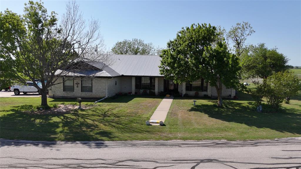 111 Lund Road Elgin, TX 78621 - Photo 8 of 15 a house that has a tree in it