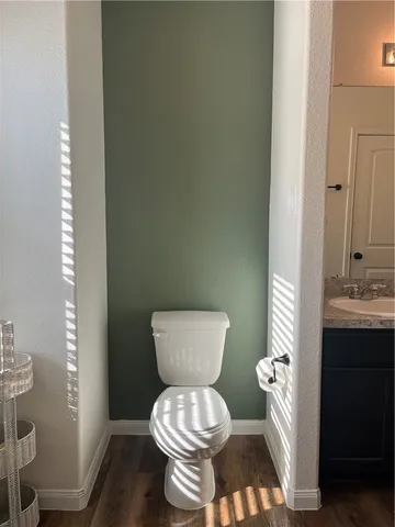 a view of a livingroom with furniture window and wooden floor