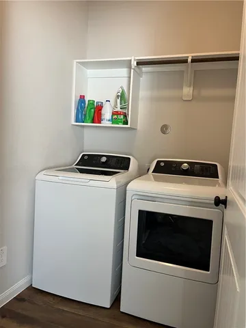 a spacious bathroom with a granite countertop toilet sink and mirror