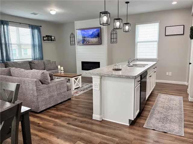 a spacious bedroom with a bed and window