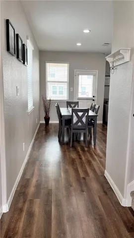a kitchen with granite countertop a refrigerator stove and microwave
