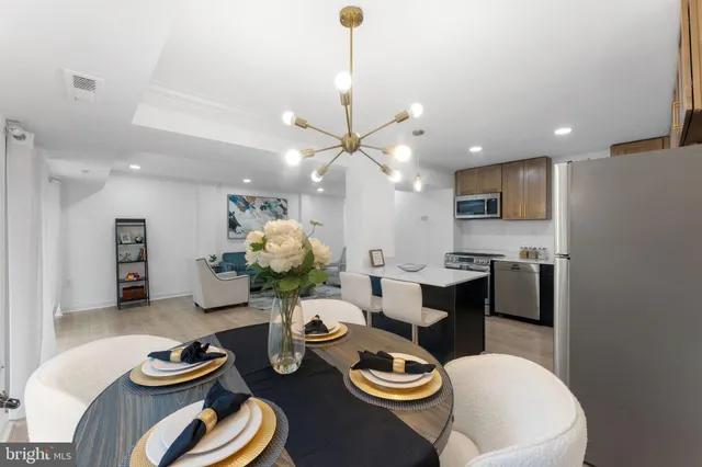 a kitchen with a table and chairs in it