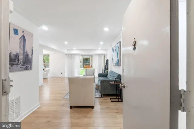 a view of a living room and dining room