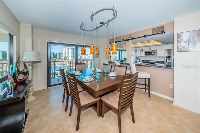 a dining room with furniture and window