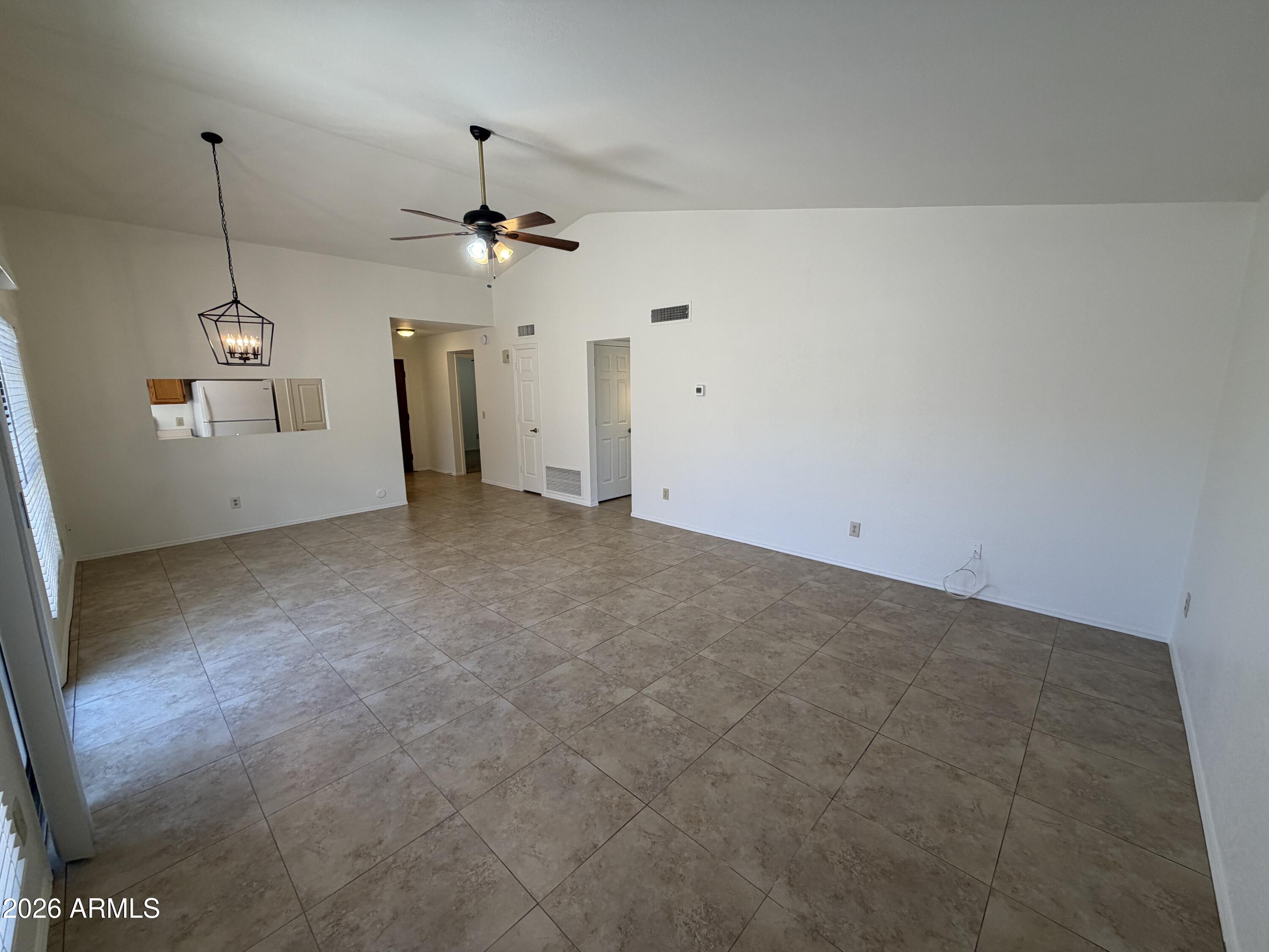 4263 East Agave Road Phoenix, AZ 85044 - Photo 7 of 21 a view of a big room with windows