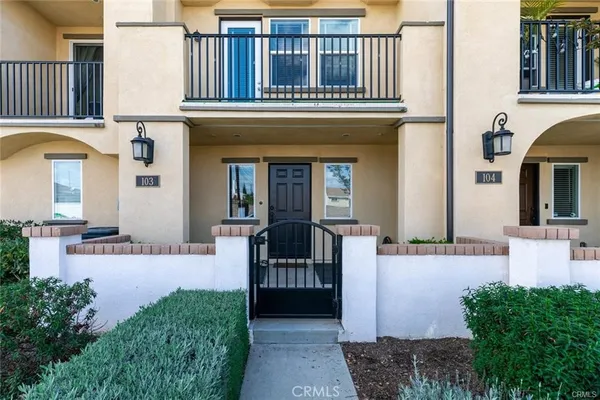 a view of a house with entrance gate