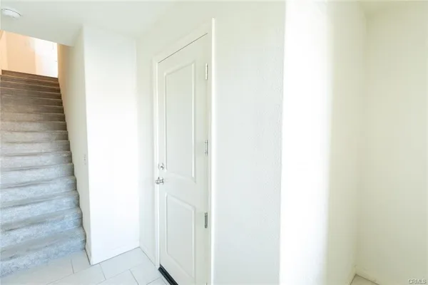 a view of staircase with white walls