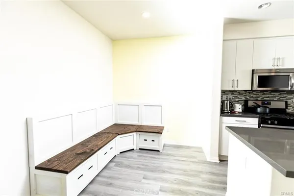 a kitchen with a sink and a microwave