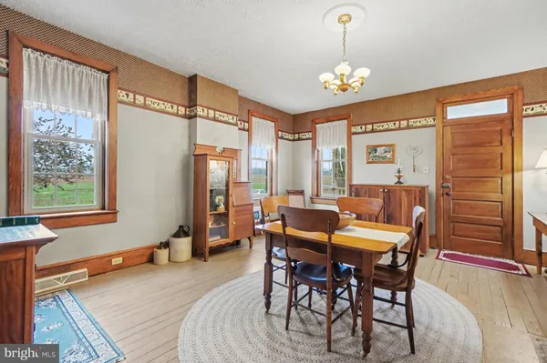 a dining room with furniture and window