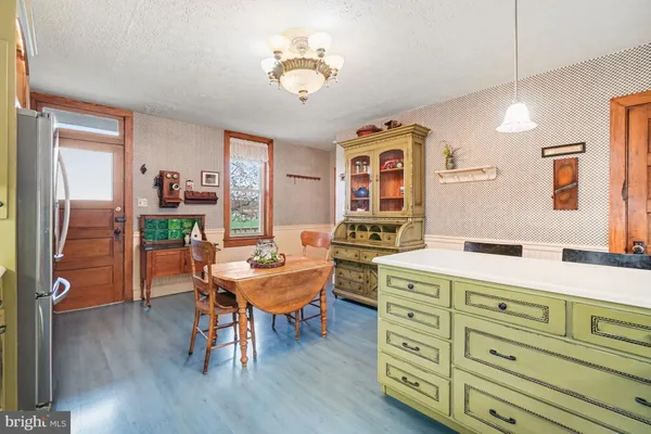 a room with chandelier furniture and a wooden floor
