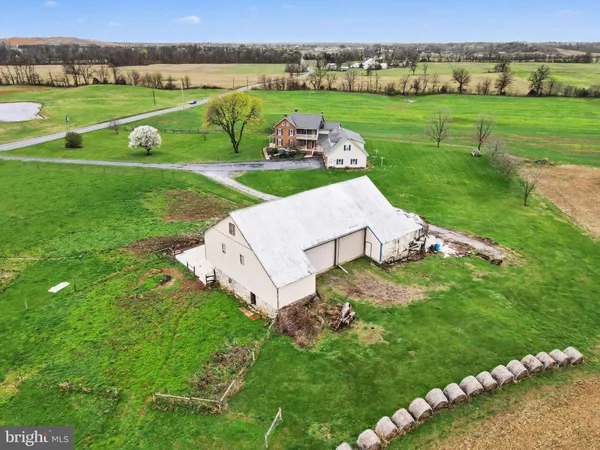 an aerial view of a house with big yard