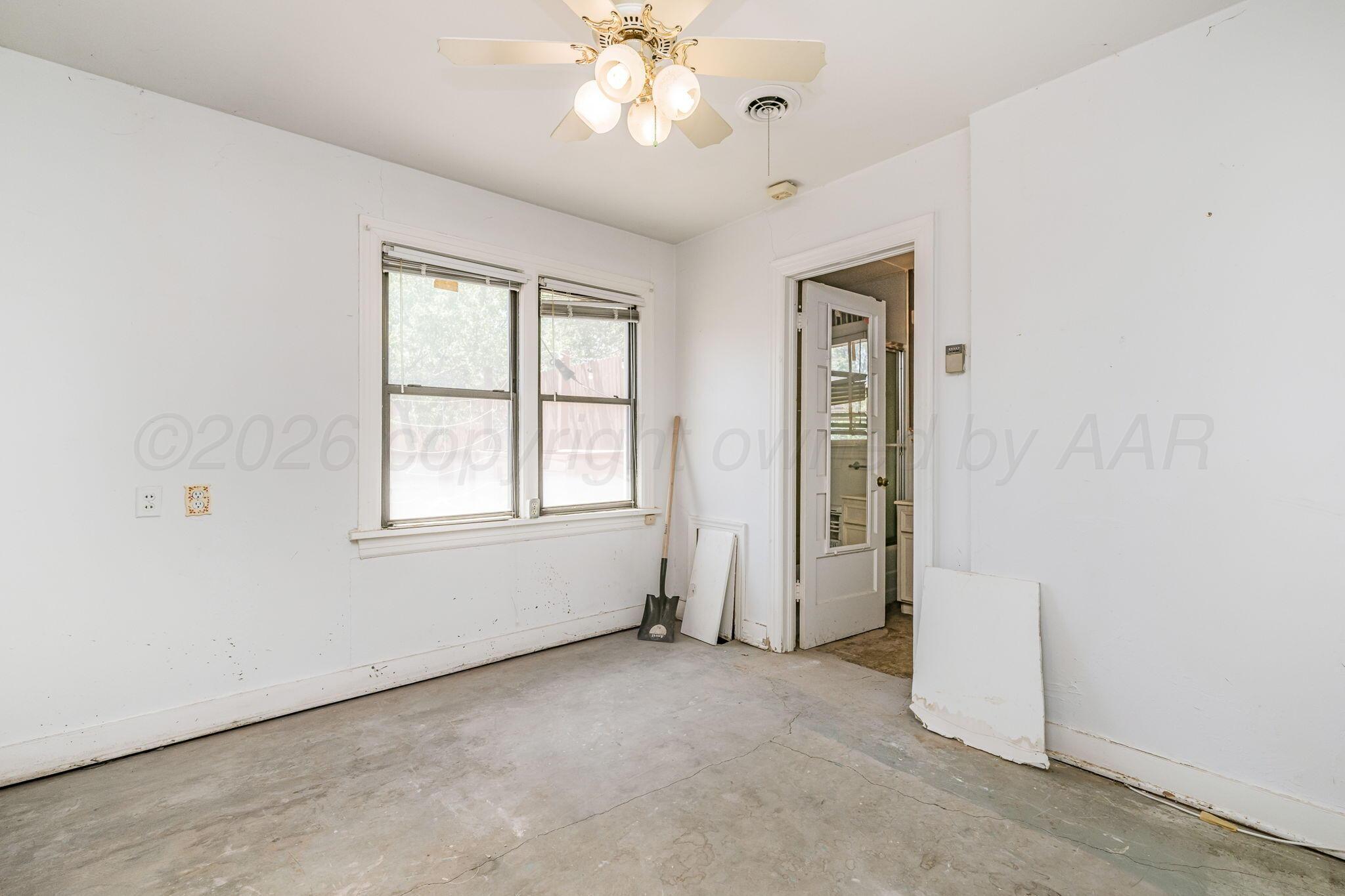 1018 South Bryan Street Amarillo, TX 79102 - Photo 27 of 41 an empty room with windows and closet