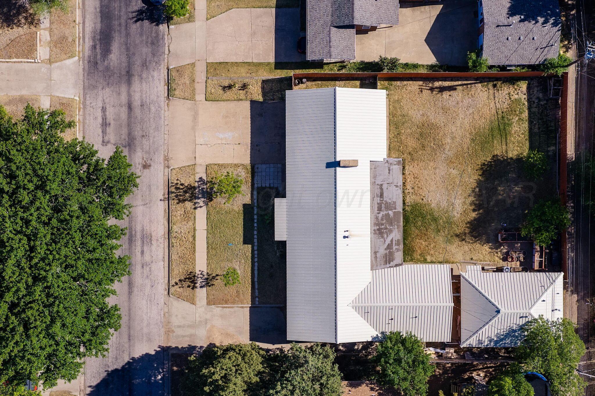 1018 South Bryan Street Amarillo, TX 79102 - Photo 41 of 41 an aerial view of a house with a yard and large tree