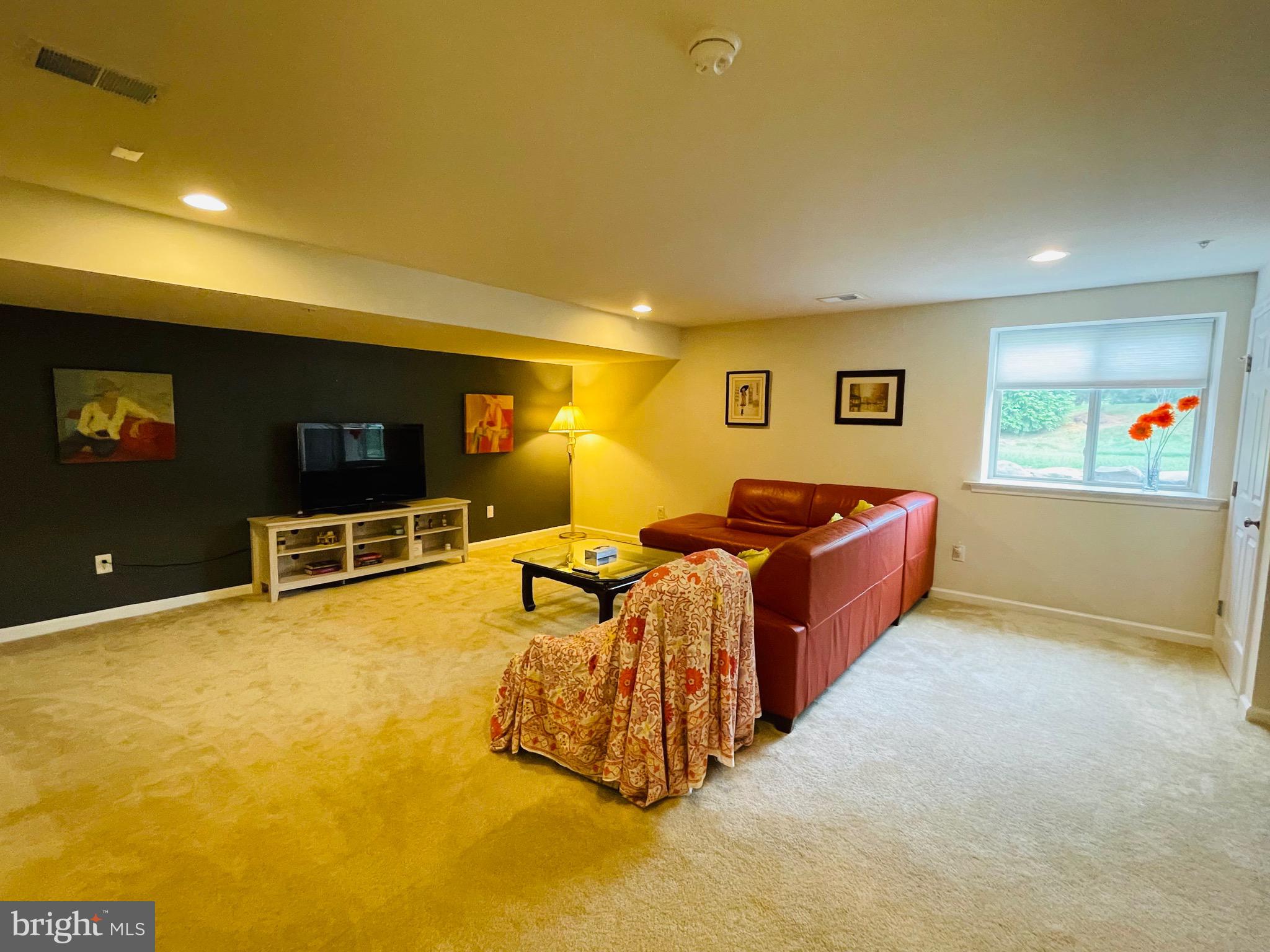 29 Chasmere Drive Kennett Square, PA 19348 - Photo 19 of 21 a living room with furniture and a flat screen tv