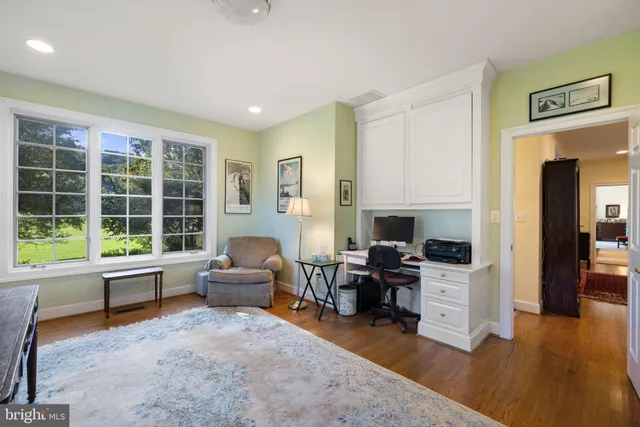 a bathroom with a granite countertop sink mirror and