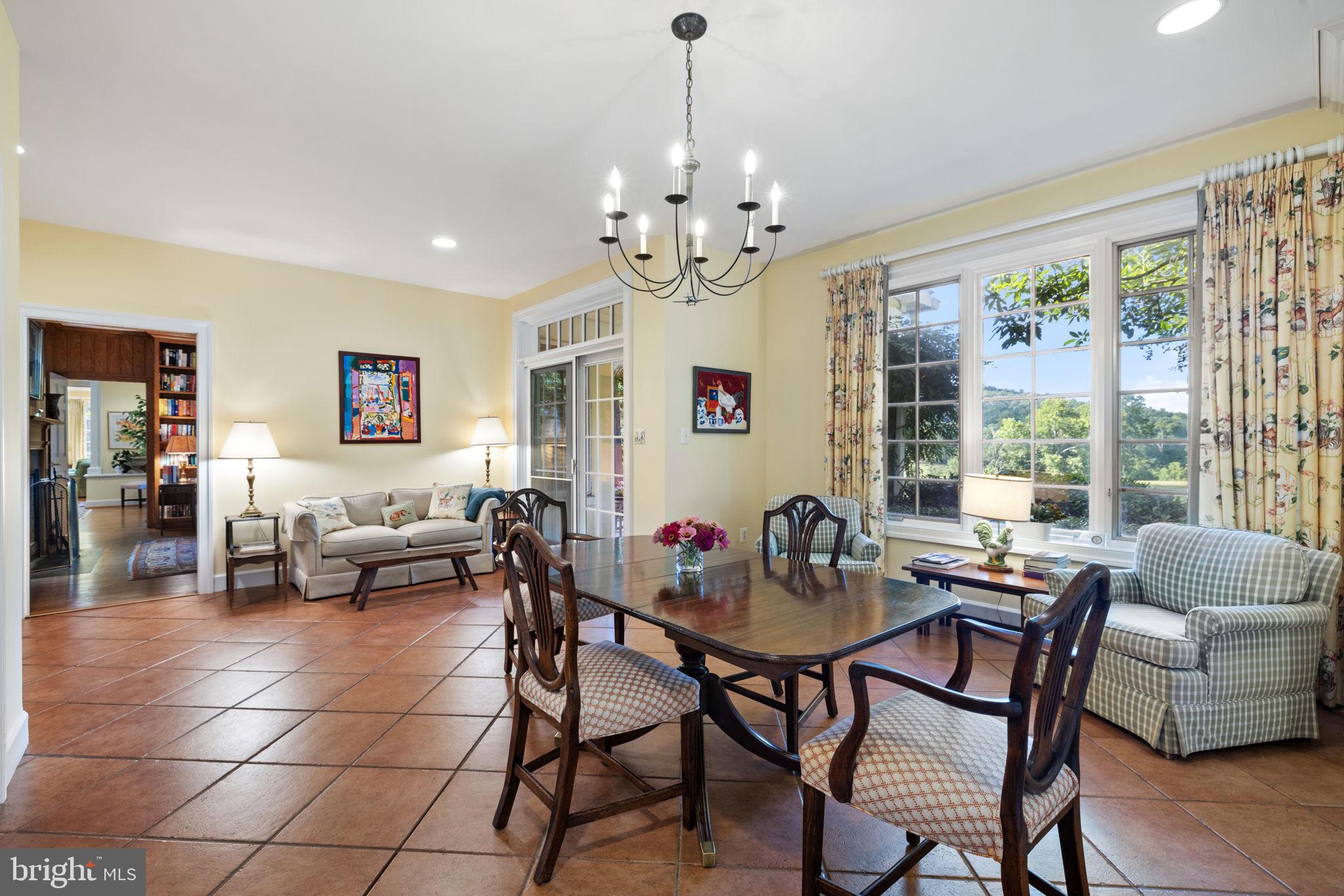 3418 Halfway Road The Plains, VA 20198 - Photo 24 of 106 a dining room with furniture a chandelier and wooden floor