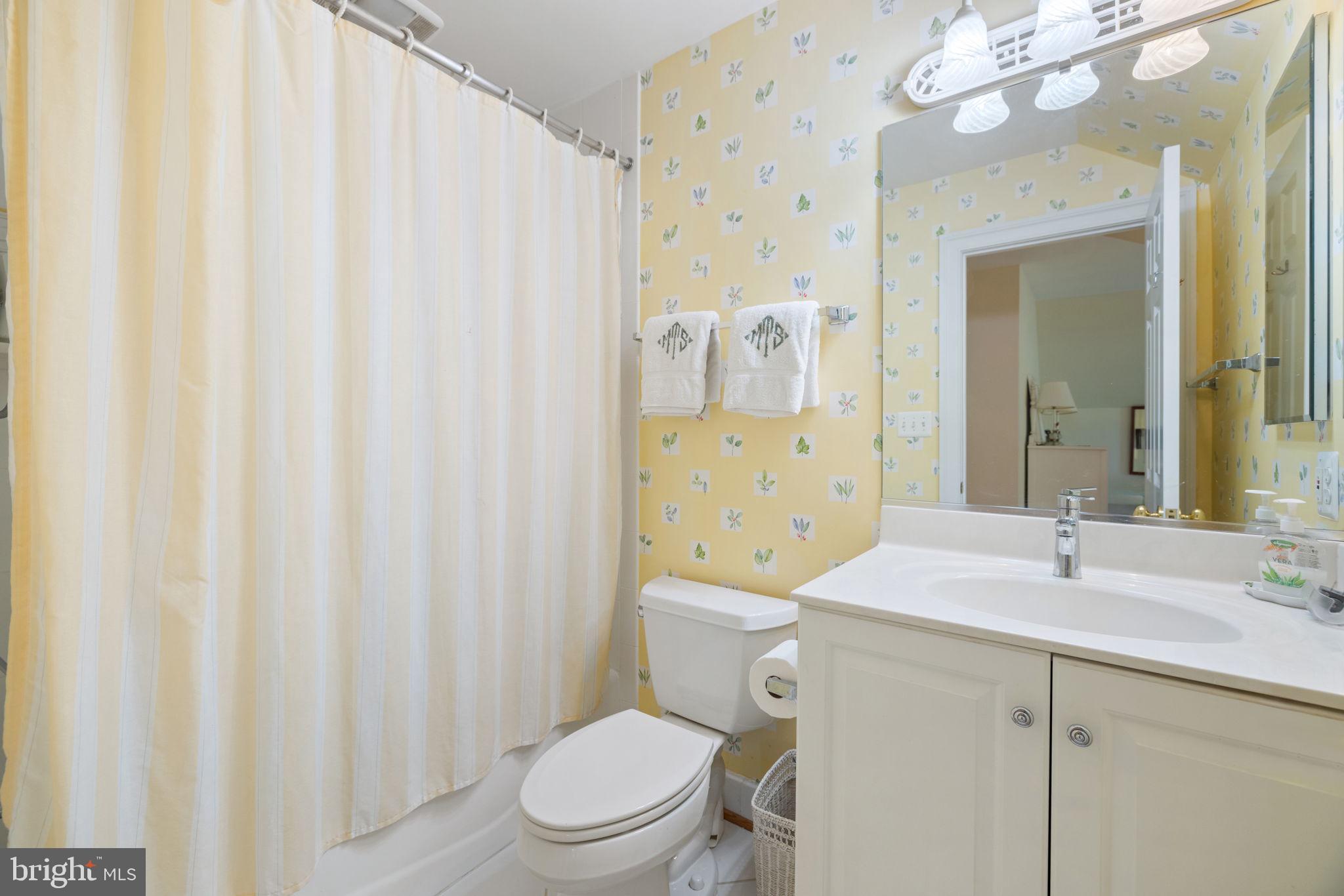 3418 Halfway Road The Plains, VA 20198 - Photo 31 of 106 a bathroom with a sink a toilet and shower curtain