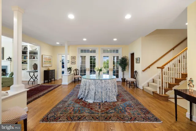 a living room with furniture a rug and a fireplace